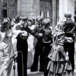 Dressed-up kids dance outside the palace.